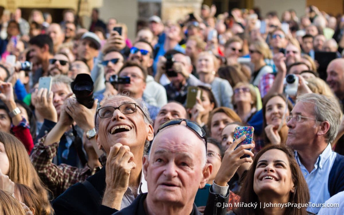 Crowd of people watching show at Astronomical Clock, Old Town Square, Prague